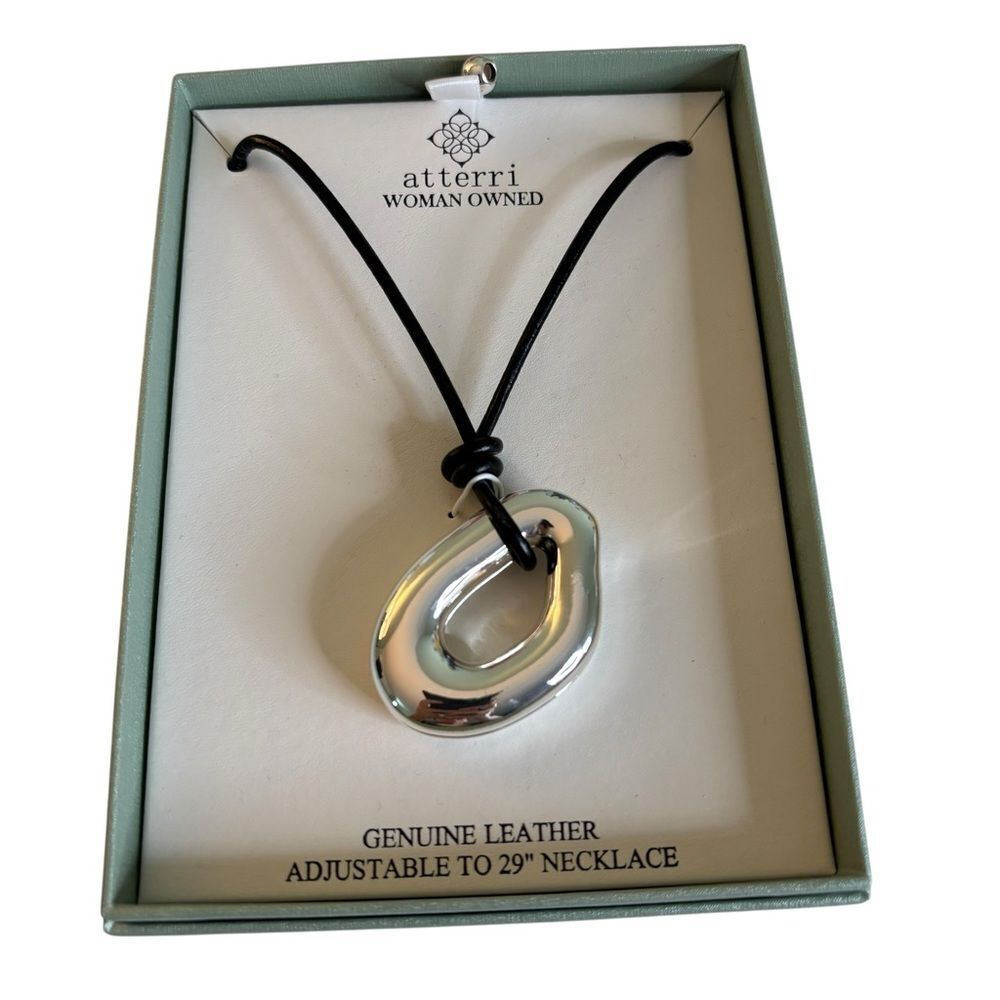Sleek Silver Toned Open Circle Pendant on Adjustable Black Leather Cord.